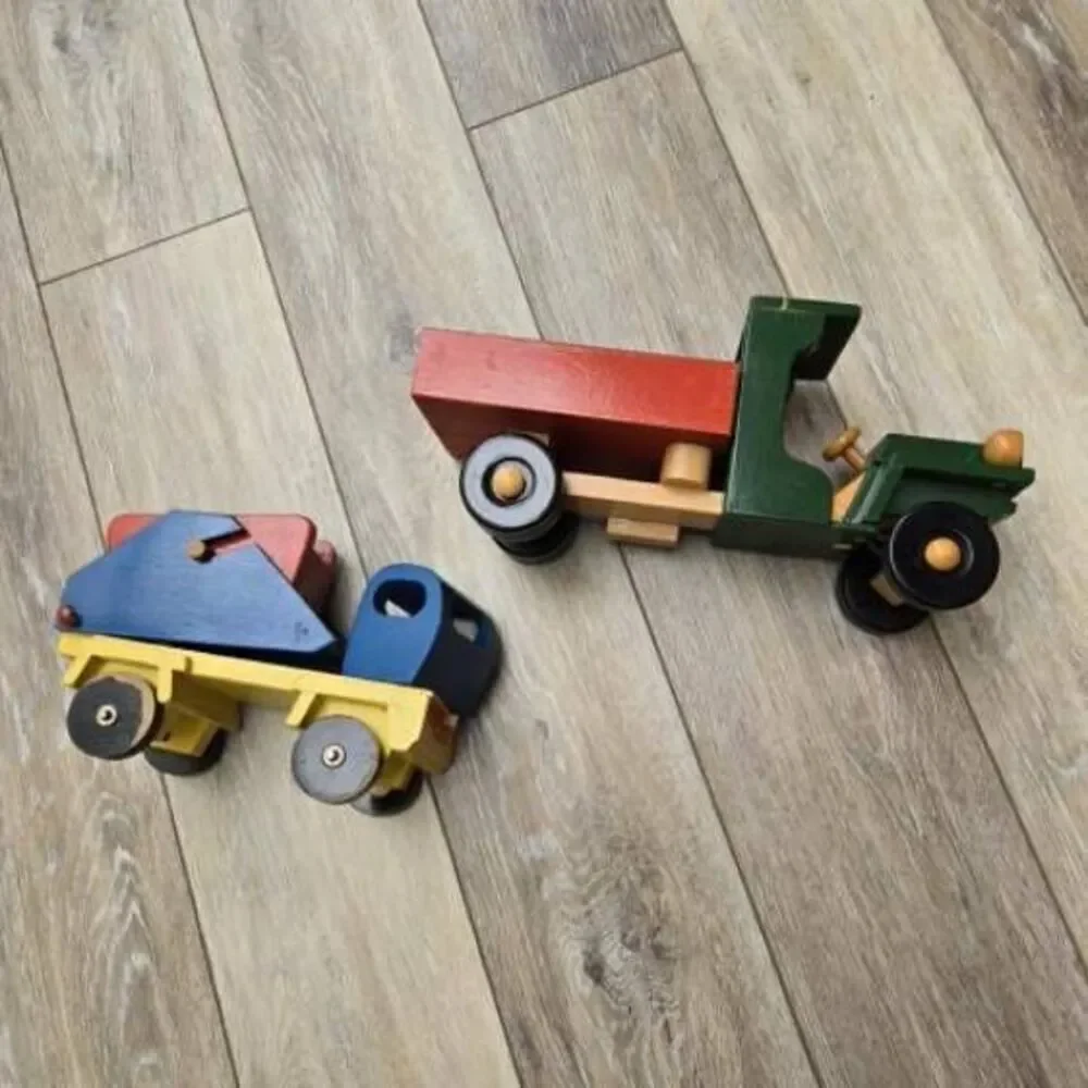 2 vintage Romania toy wooden trucks colorful, moving parts collectible